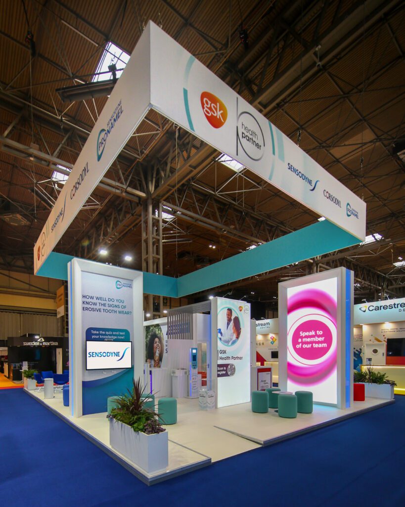 gsk stand at a dentistry show with hanging banner above